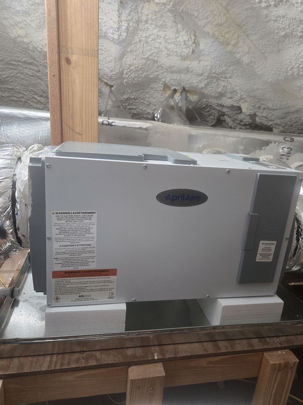 AprilAire whole-house dehumidifier installed in attic